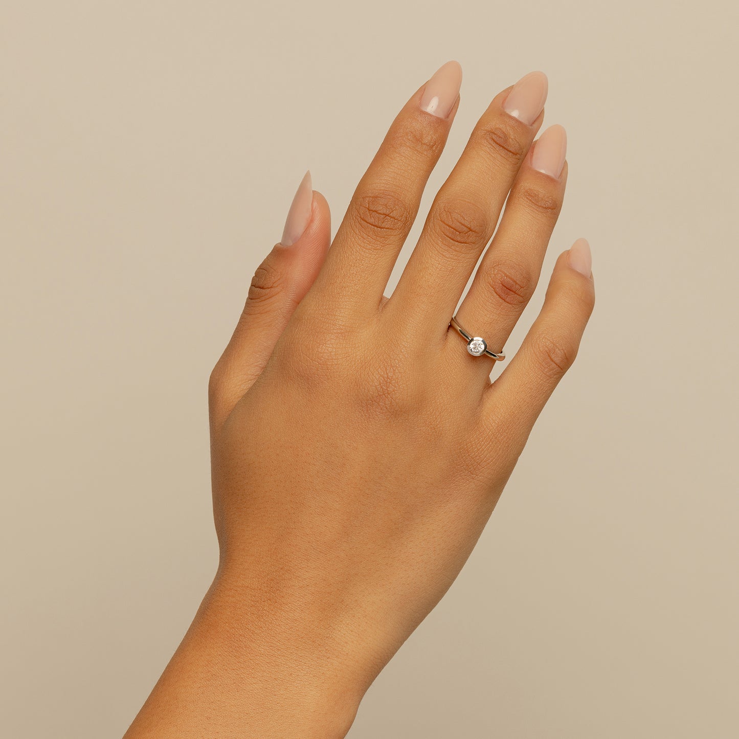 Petite Round Bezel Engagement Ring On Body 