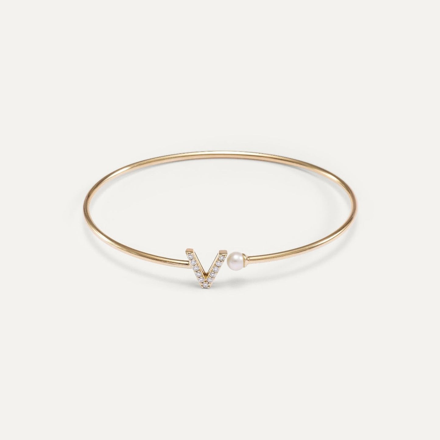Bangle bracelet with initial and pearl