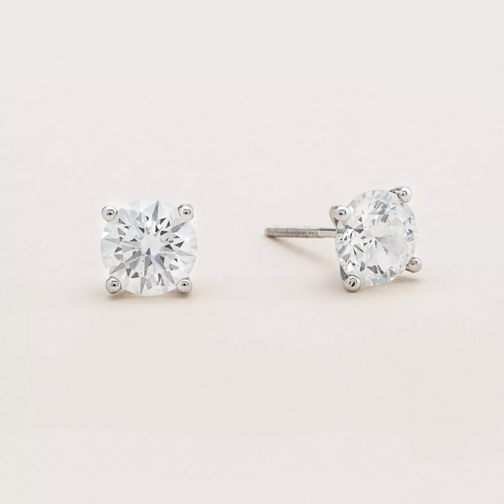 Diamond solitaire discount earrings