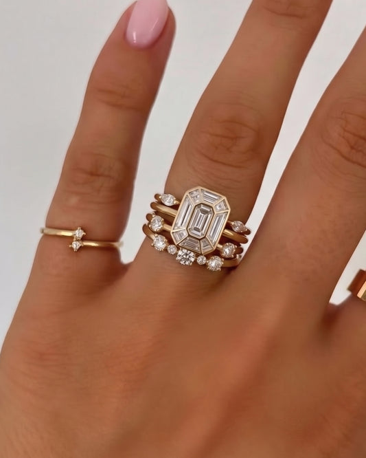 Emerald cut custom diamond ring stack on hand