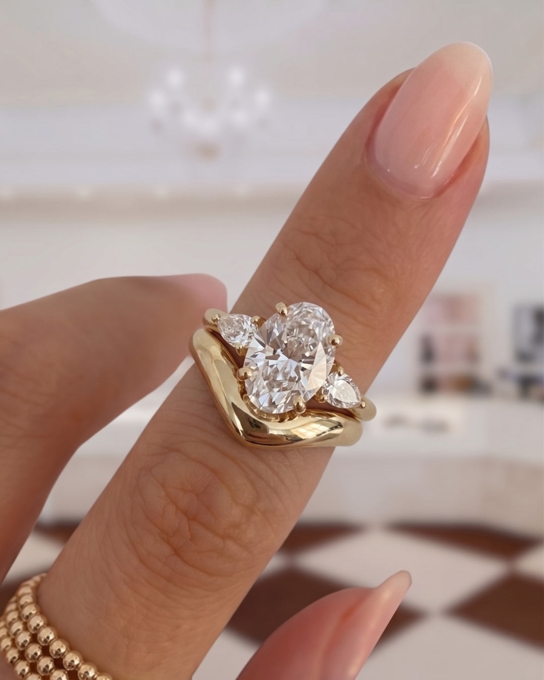 Oval & Pear Diamond Three Stone Engagement Ring