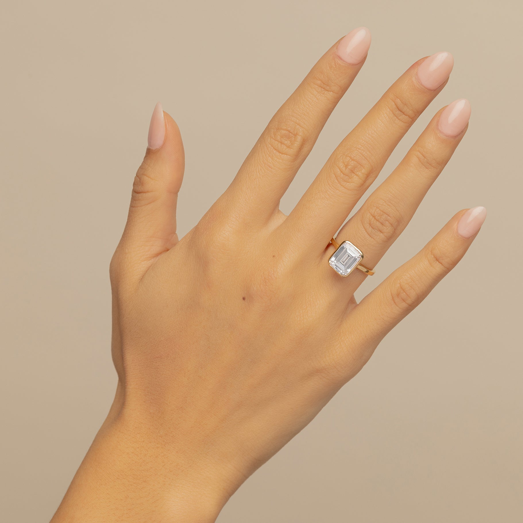 Emerald-Cut Diamond Bezel Engagement Ring On Body