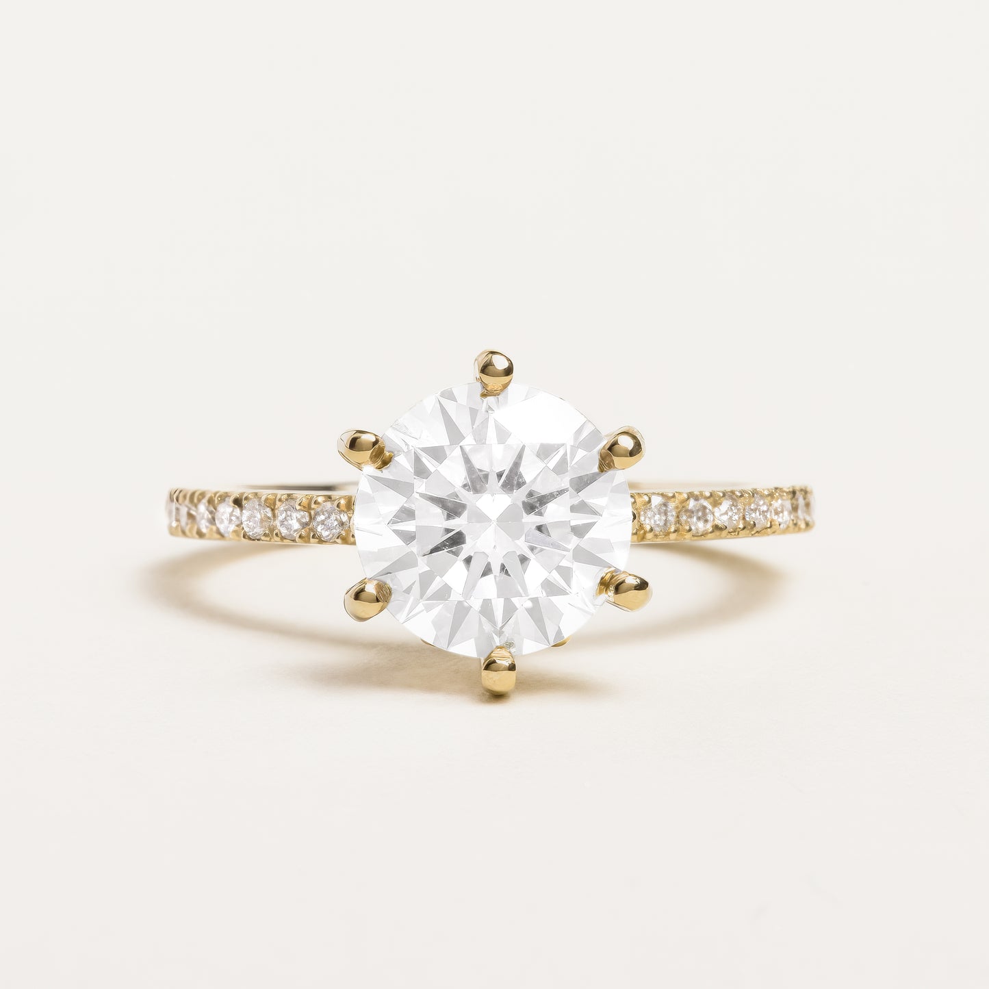 Brilliant Round Cut Ring with Pavé and Flower Prongs