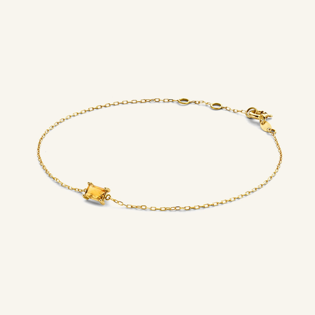 Jackie Amsterdam Medina Citrine bracelet in 14K yellow gold on pale beige background