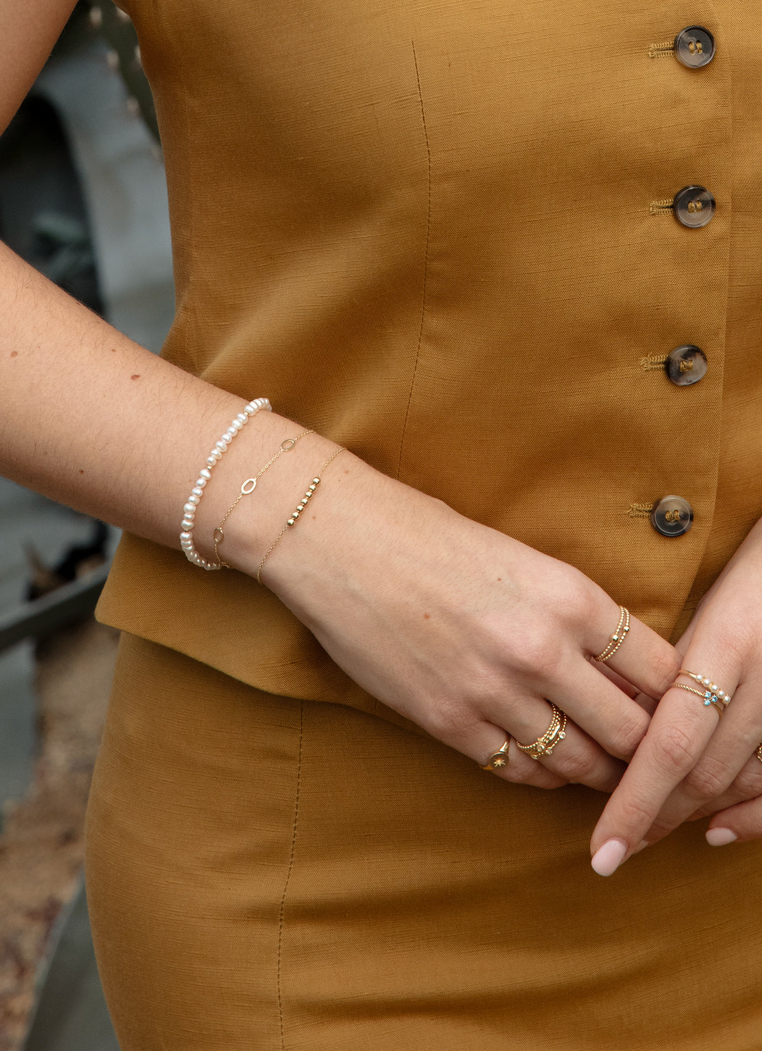 Jackie Amsterdam Pearl Potion Bracelet in 14K Yellow Gold worn on wrist