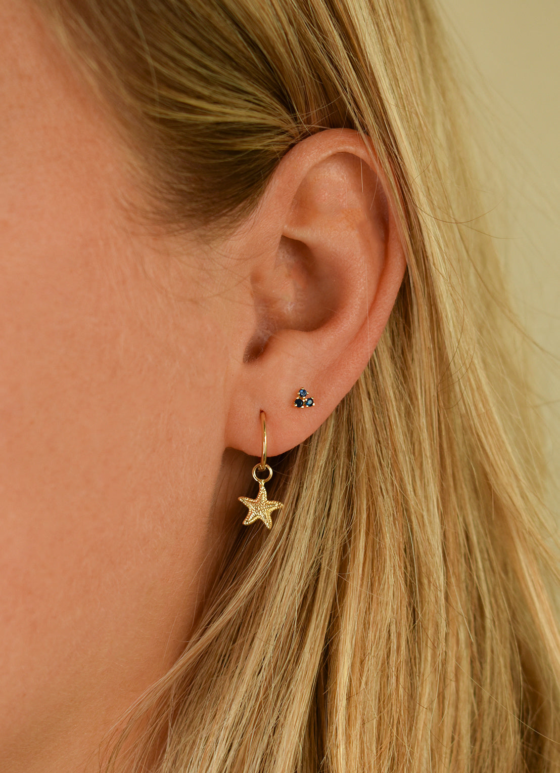 Jackie Amsterdam Starfish Ear Charm in 14K Yellow Gold worn on model