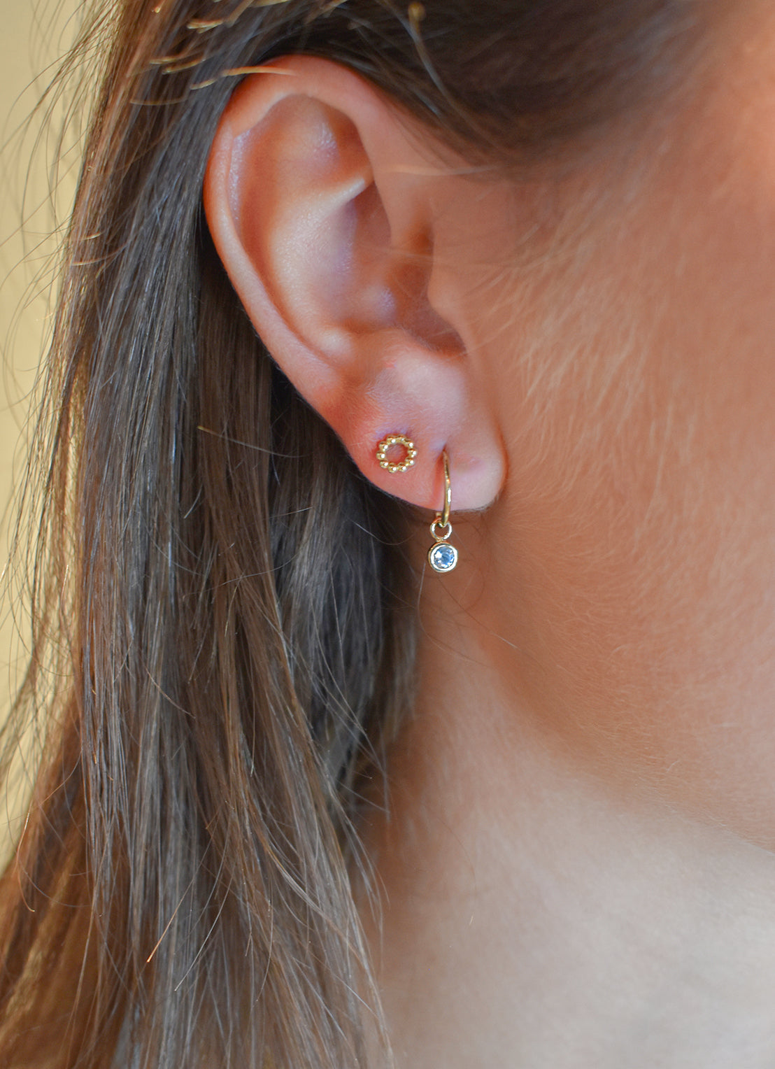 Jackie Amsterdam Blue Topaz Ear Charm in 14K Yellow Gold worn on model