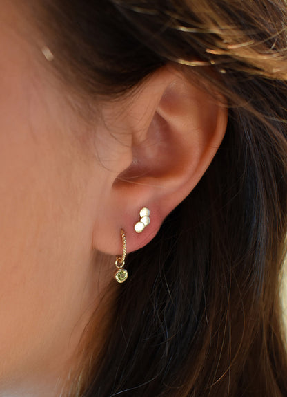 Jackie Triple Disc Studs in 14K Yellow Gold worn on ear