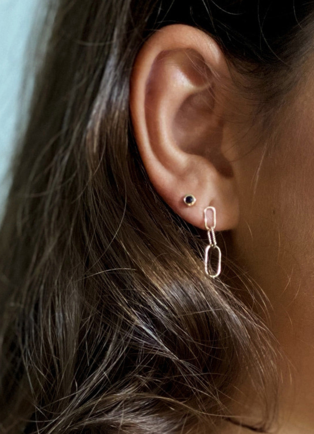 Sapphire Studs in 14K Yellow Gold worn on ear