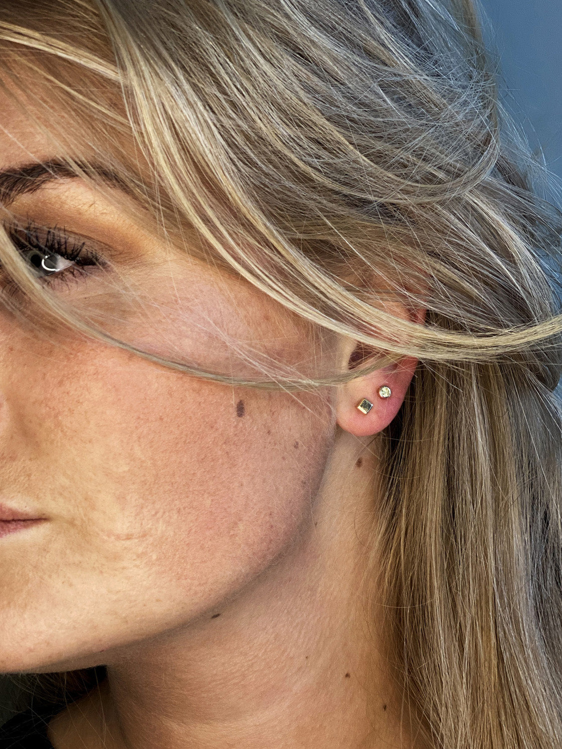 Jackie Peridot Studs in 14K Yellow Gold worn on ear