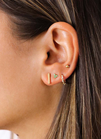 Jackie Triangle Emerald Studs in 14K Yellow Gold worn on ear