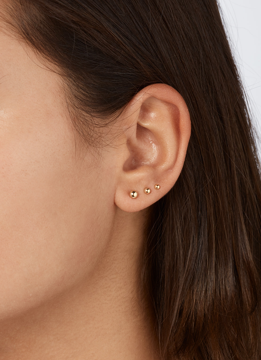 Jackie Ball Studs in 14K Yellow Gold worn on ear