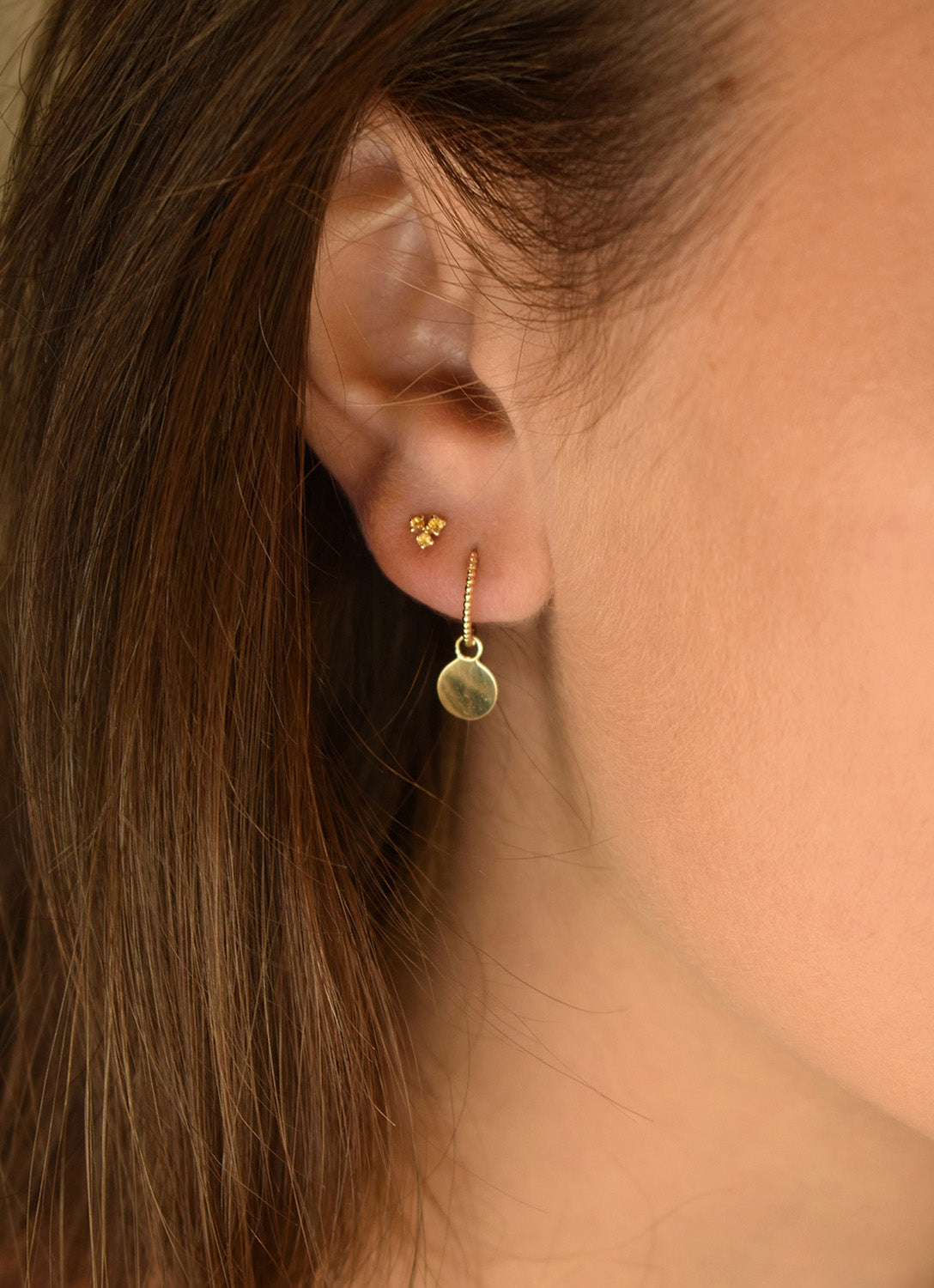 Jackie Fez Disc Hoops in 14K Yellow Gold worn on ear