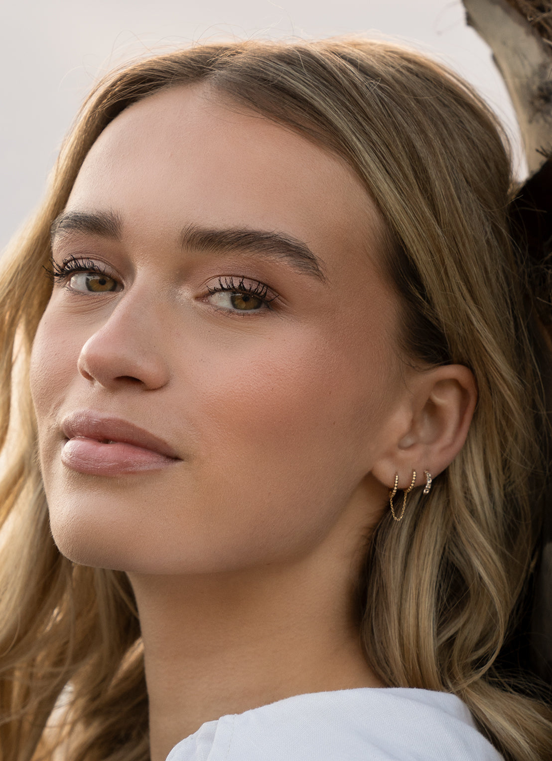 Jackie Gaudi Variado Topaz Studs in 14K Yellow Gold worn on ear