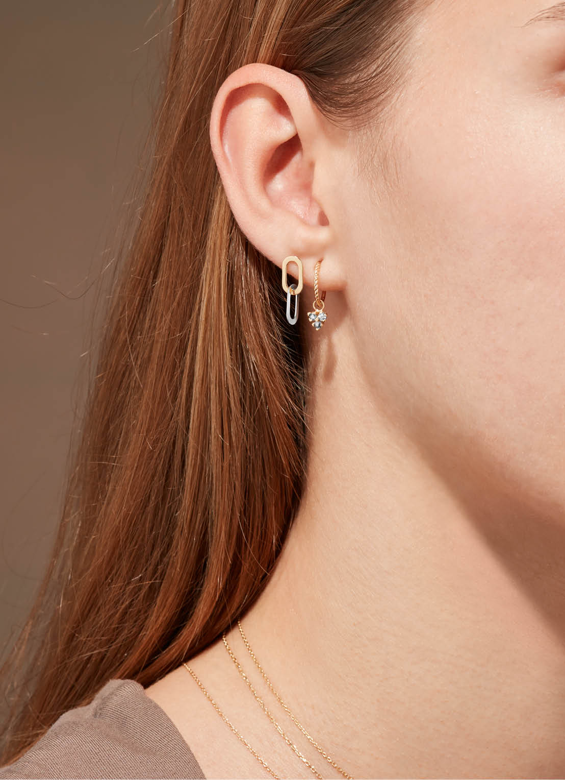 Jackie Triangle White Topaz Hoops in 14K Yellow Gold worn on ear