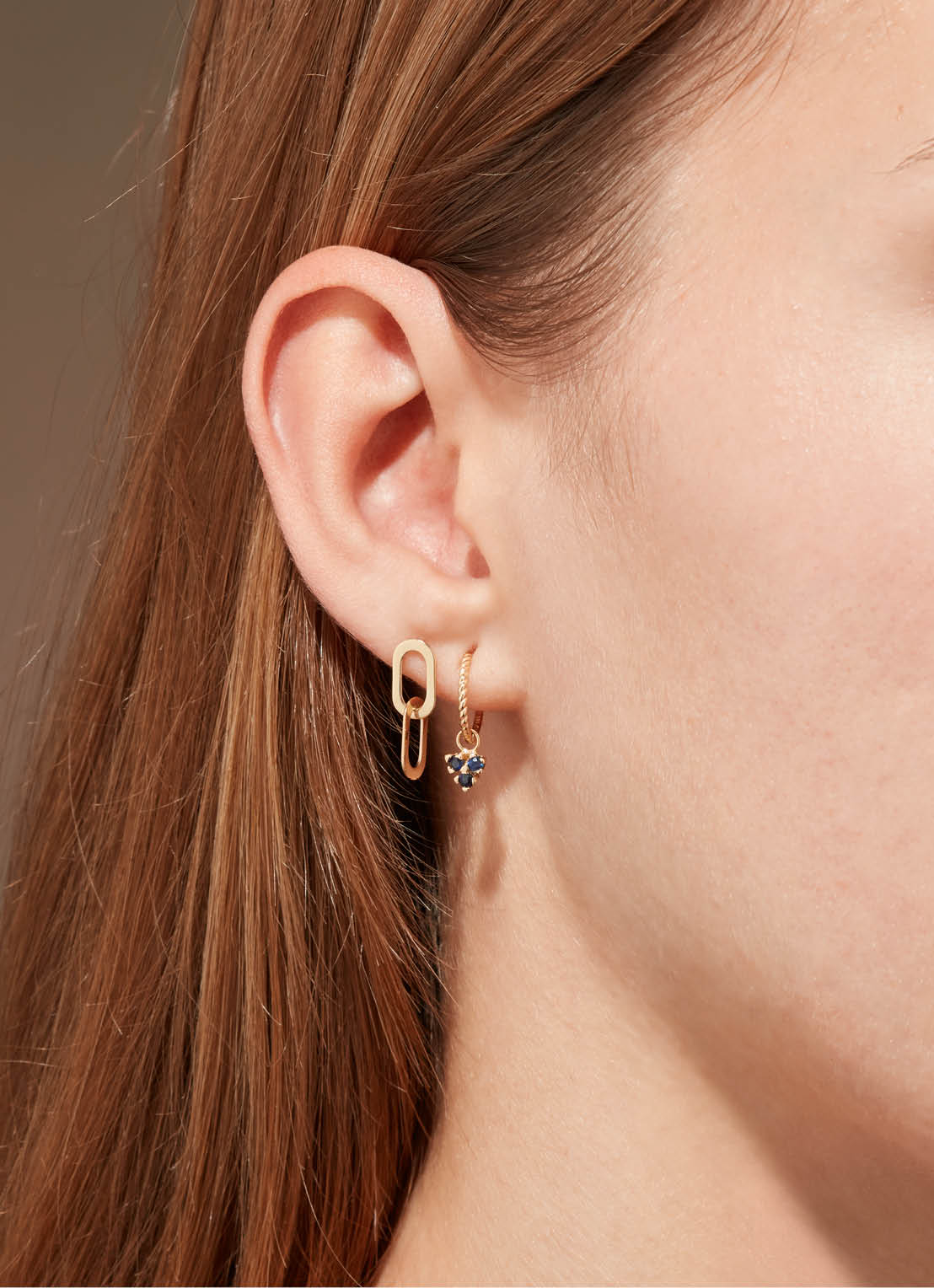 Jackie Triangle Sapphire Hoops in 14K Yellow Gold worn on ear