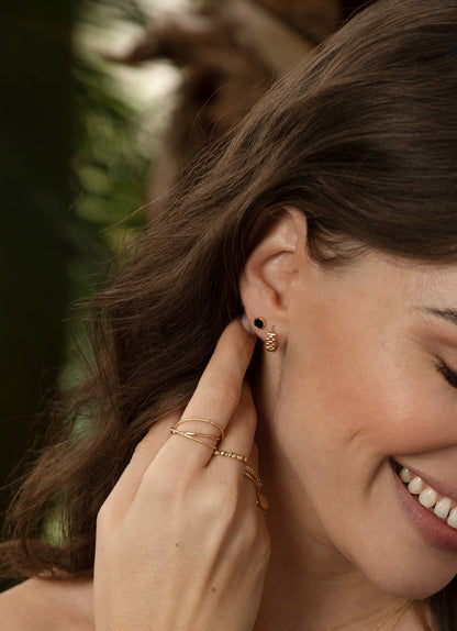 Jackie Guell Hoops in 14K Yellow Gold worn on ear