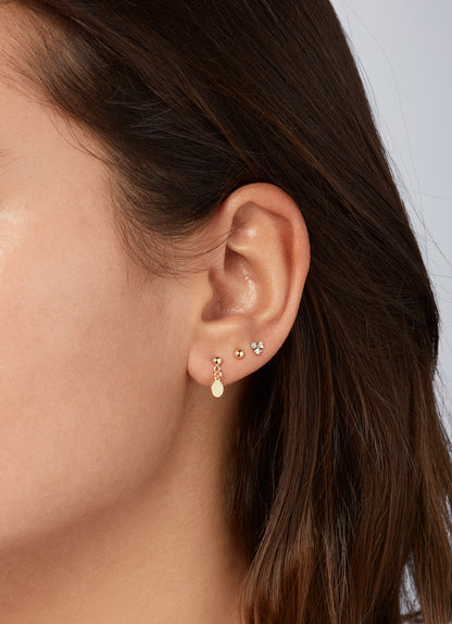 Jackie Dangling Disc Studs in 14K Yellow Gold worn on ear