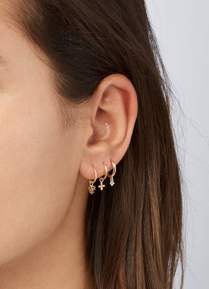 Jackie Shining Star Hoops in 14K Yellow Gold worn on ear
