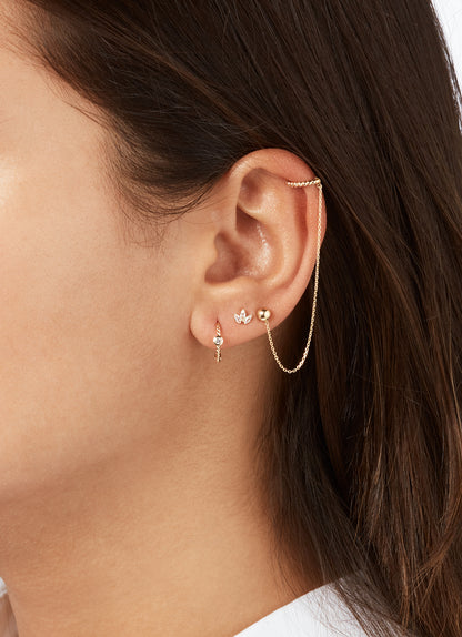 Jackie Palm Breeze White Topaz Studs in 14K Yellow Gold worn on ear