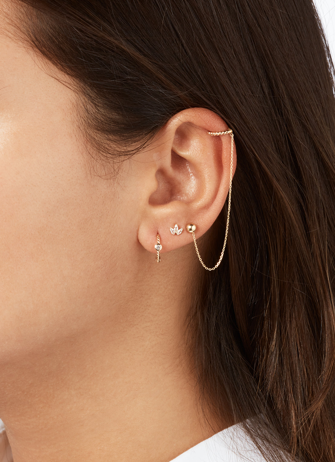 Jackie Oasis White Topaz Hoops in 14K Yellow Gold worn on ear