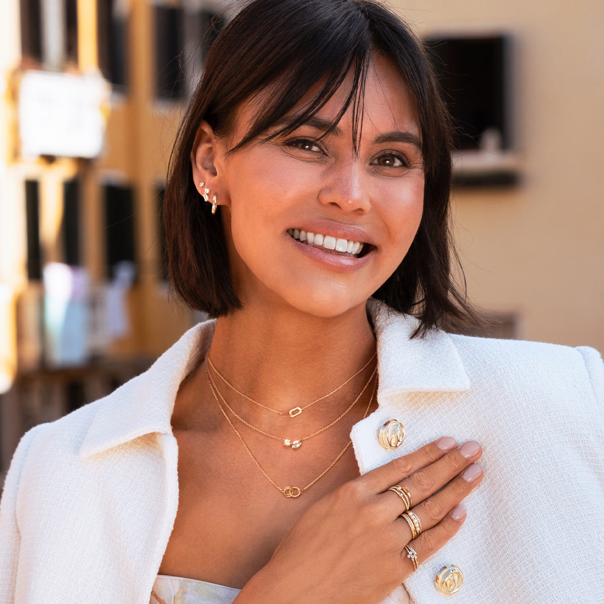 Jackie Festive Sparkling Studs in 14K Yellow Gold worn on ear
