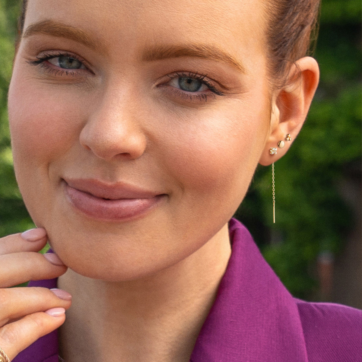 Jackie Holland Studs 4mm in 14K Yellow Gold worn on ear