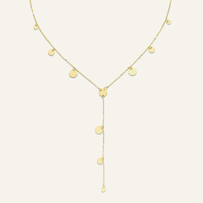Jackie Amsterdam Dazzle Y-Necklace in 14K yellow gold on pale beige background