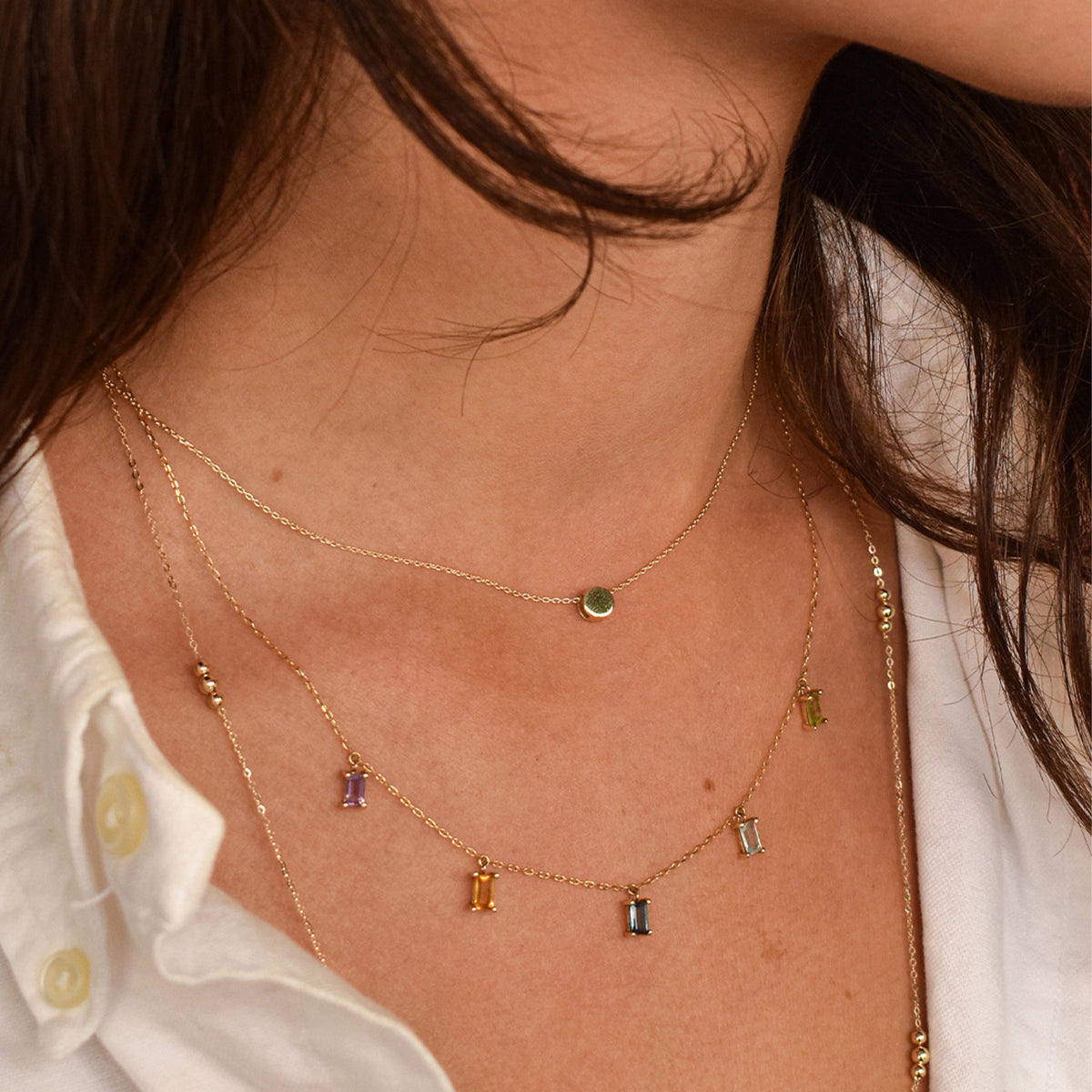 Jackie Amsterdam Plain Circle necklace worn layered on model