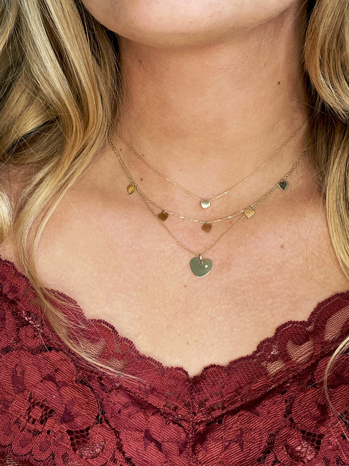 Jackie Amsterdam Plain Heart necklace worn layered on model