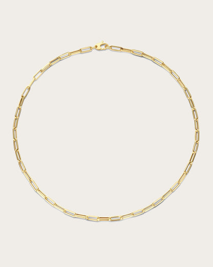 Jackie Amsterdam Elegant Boxlink necklace in 14K yellow gold on light beige background
