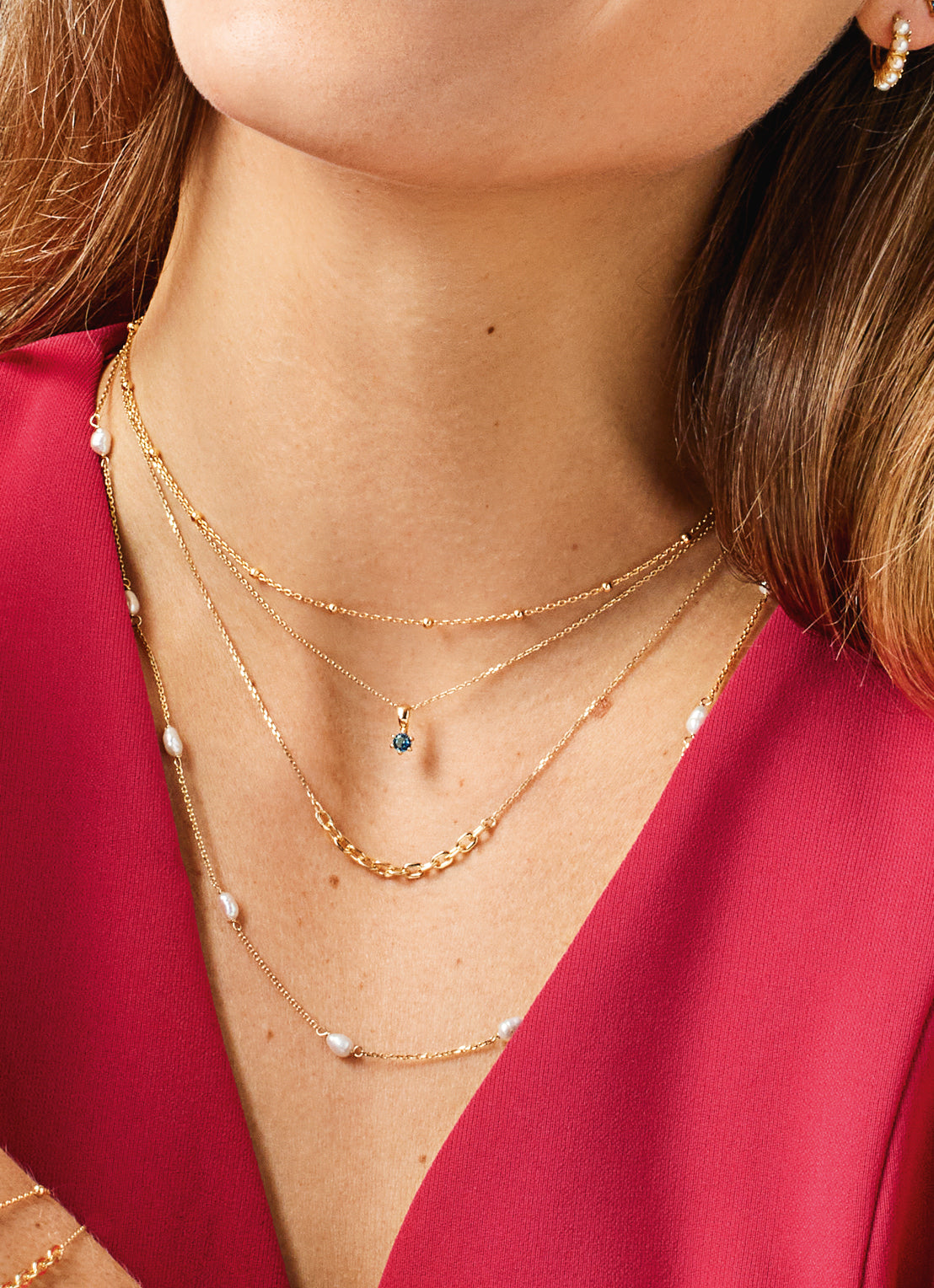 Jackie Amsterdam Dotted necklace worn layered on model