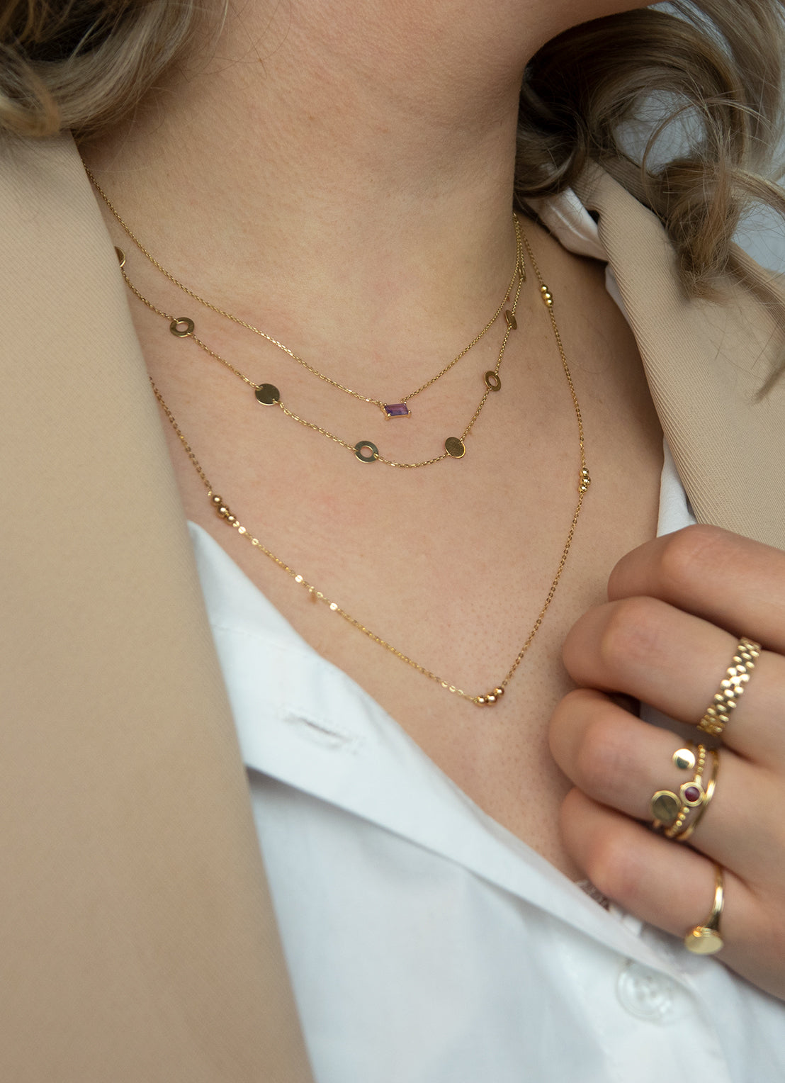 Jackie Amsterdam Medina Amethyst necklace worn layered on model
