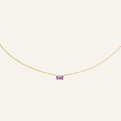 Jackie Amsterdam Medina Amethyst necklace in 14K yellow gold on pale beige background