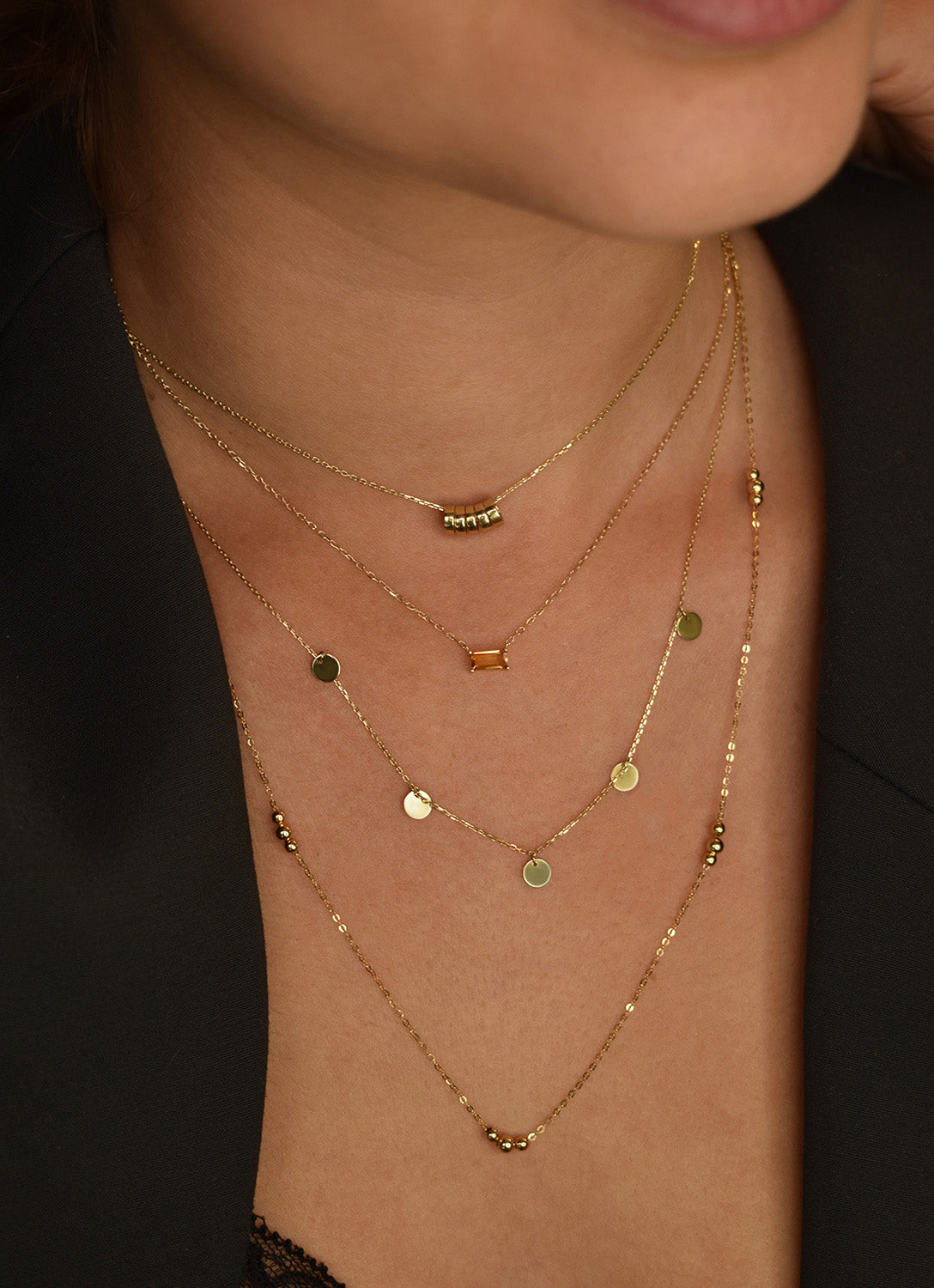 Jackie Amsterdam Medina Citrine necklace worn layered on model