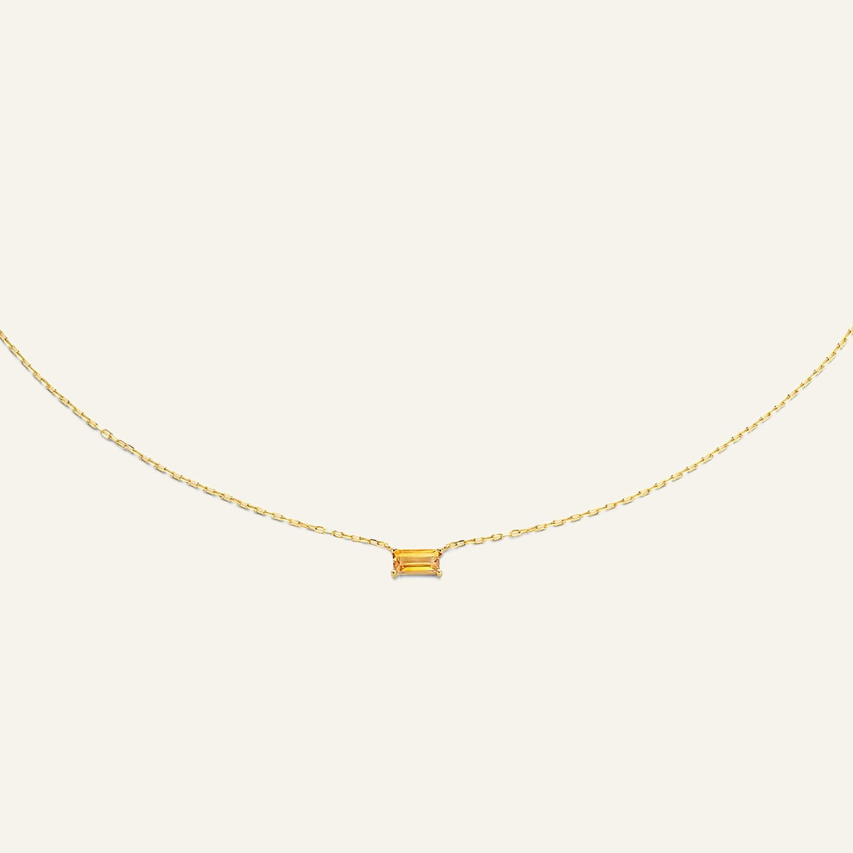 Jackie Amsterdam Medina Citrine necklace in 14K yellow gold on pale beige background