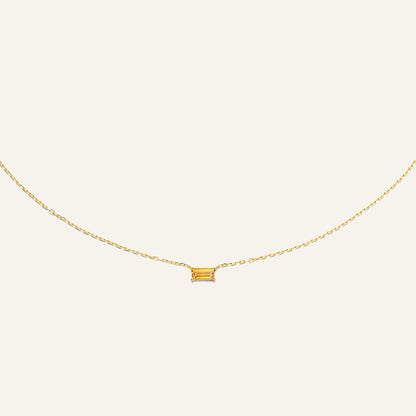 Jackie Amsterdam Medina Citrine necklace in 14K yellow gold on pale beige background
