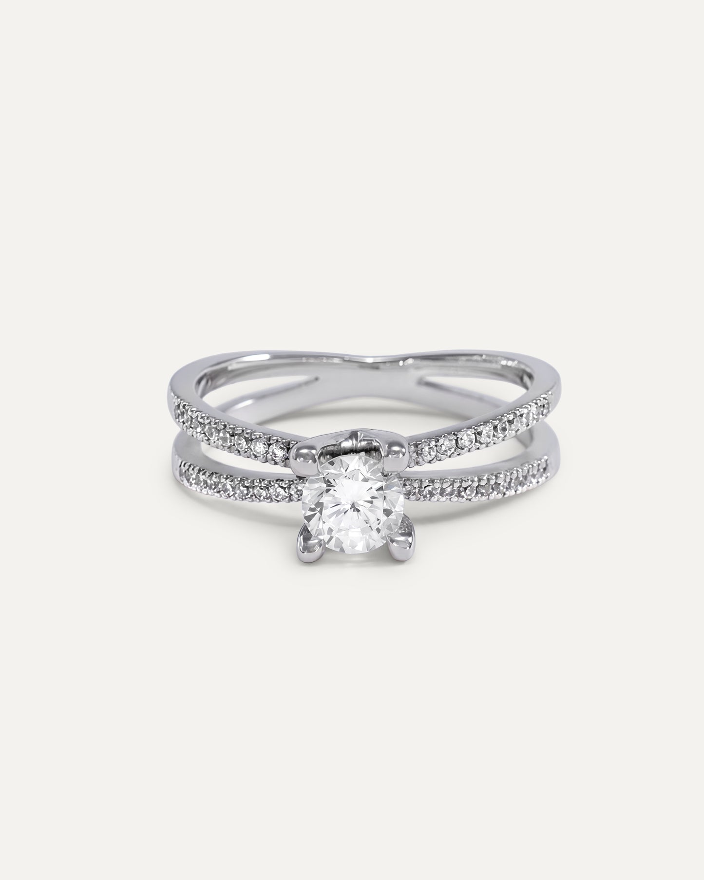 Round cut diamond engagement ring with split pavé bands