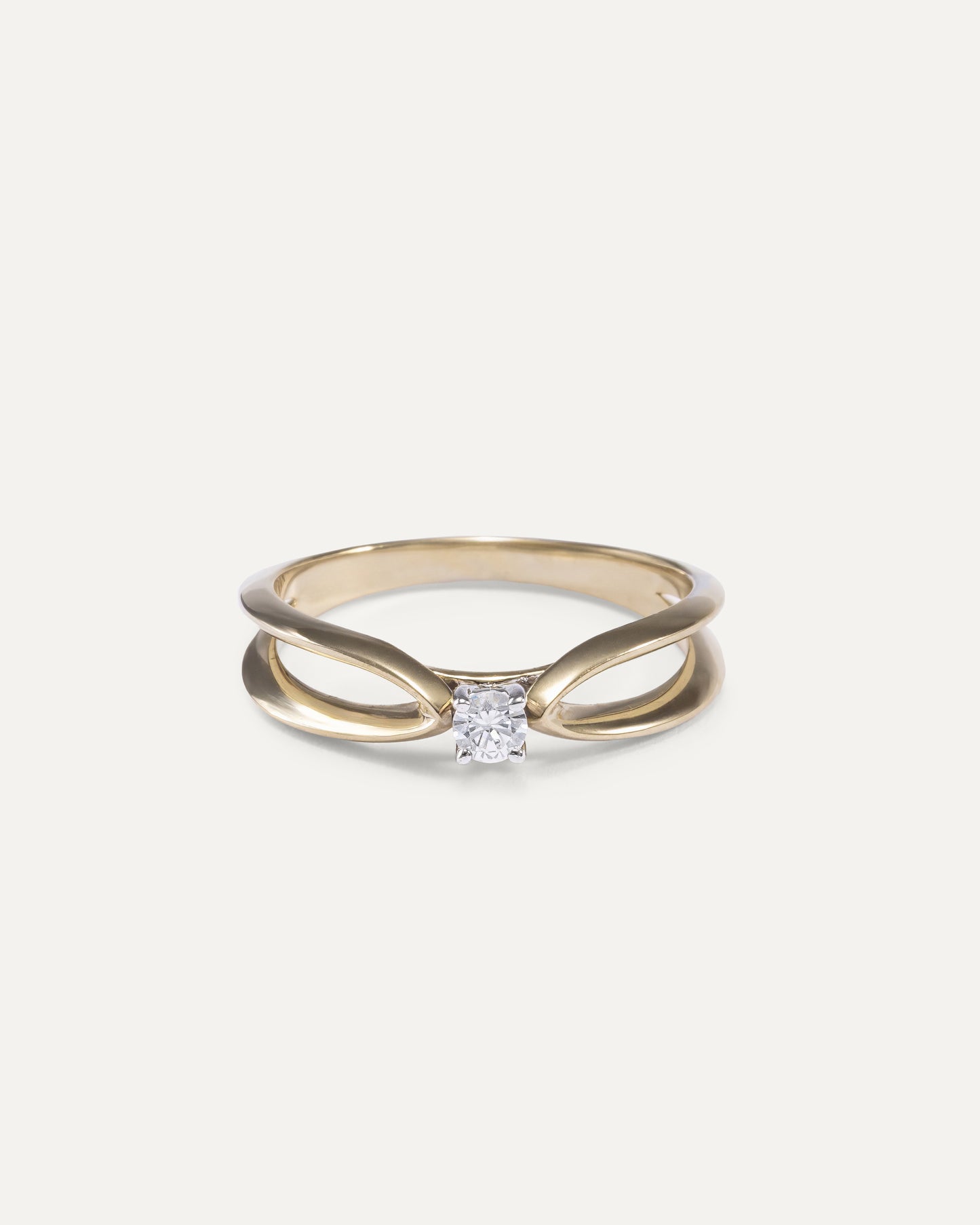 Round cut diamond engagement ring with loop design