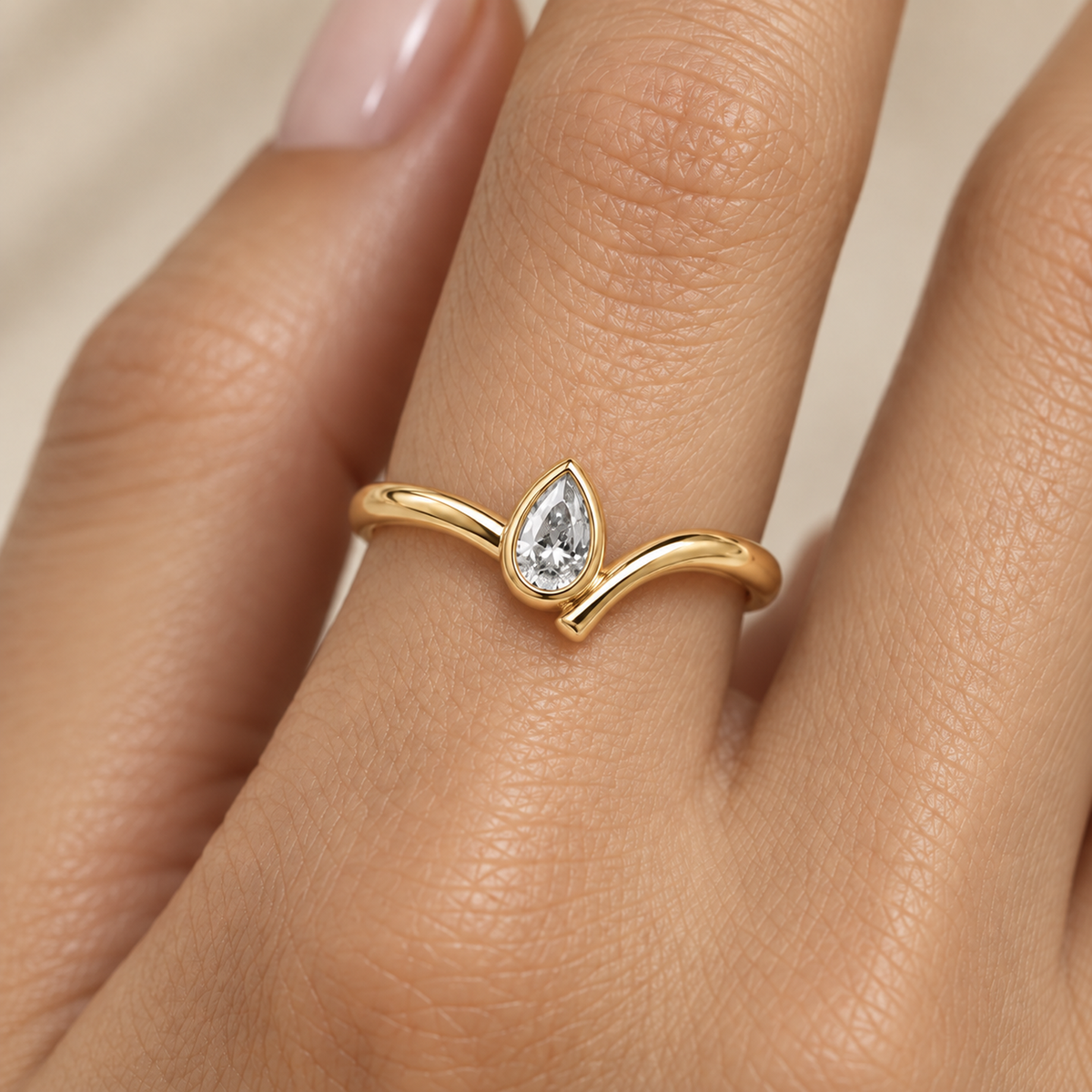 Pear Bezel Wave Diamond Ring in Gold illustrative worn view with indicative color and proportions