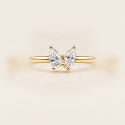 Double Pear Diamond Ring in Gold product photo on warm beige background