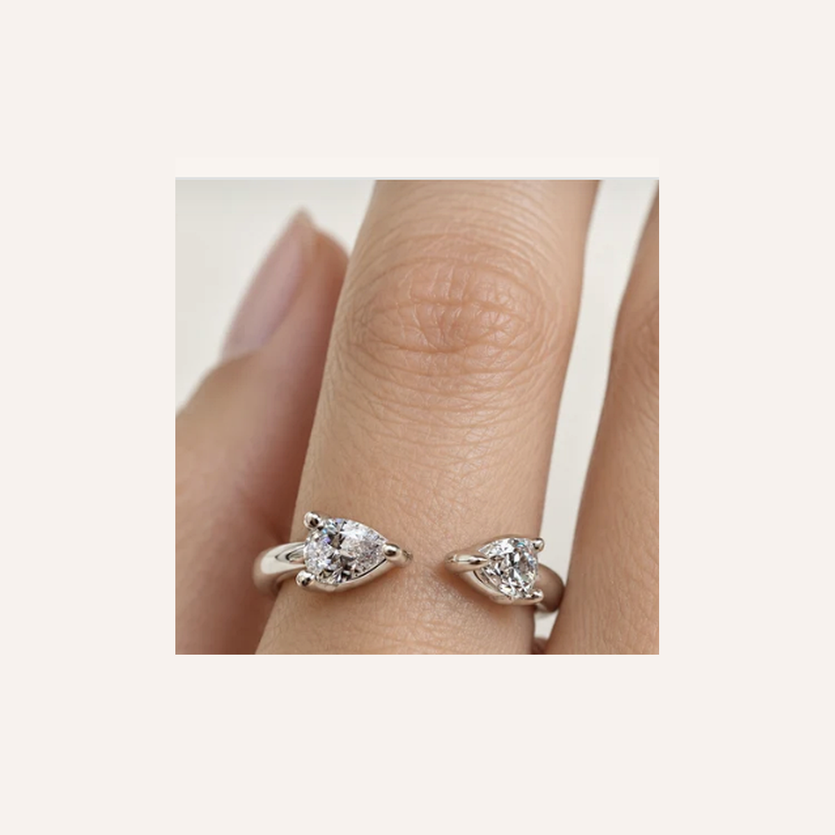 Open Pear Diamond Ring in Gold close-up worn on finger, indicative color and proportions