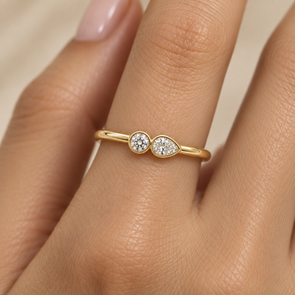 Round and Pear Bezel Diamond Ring in Gold illustrative worn view with indicative color and proportions