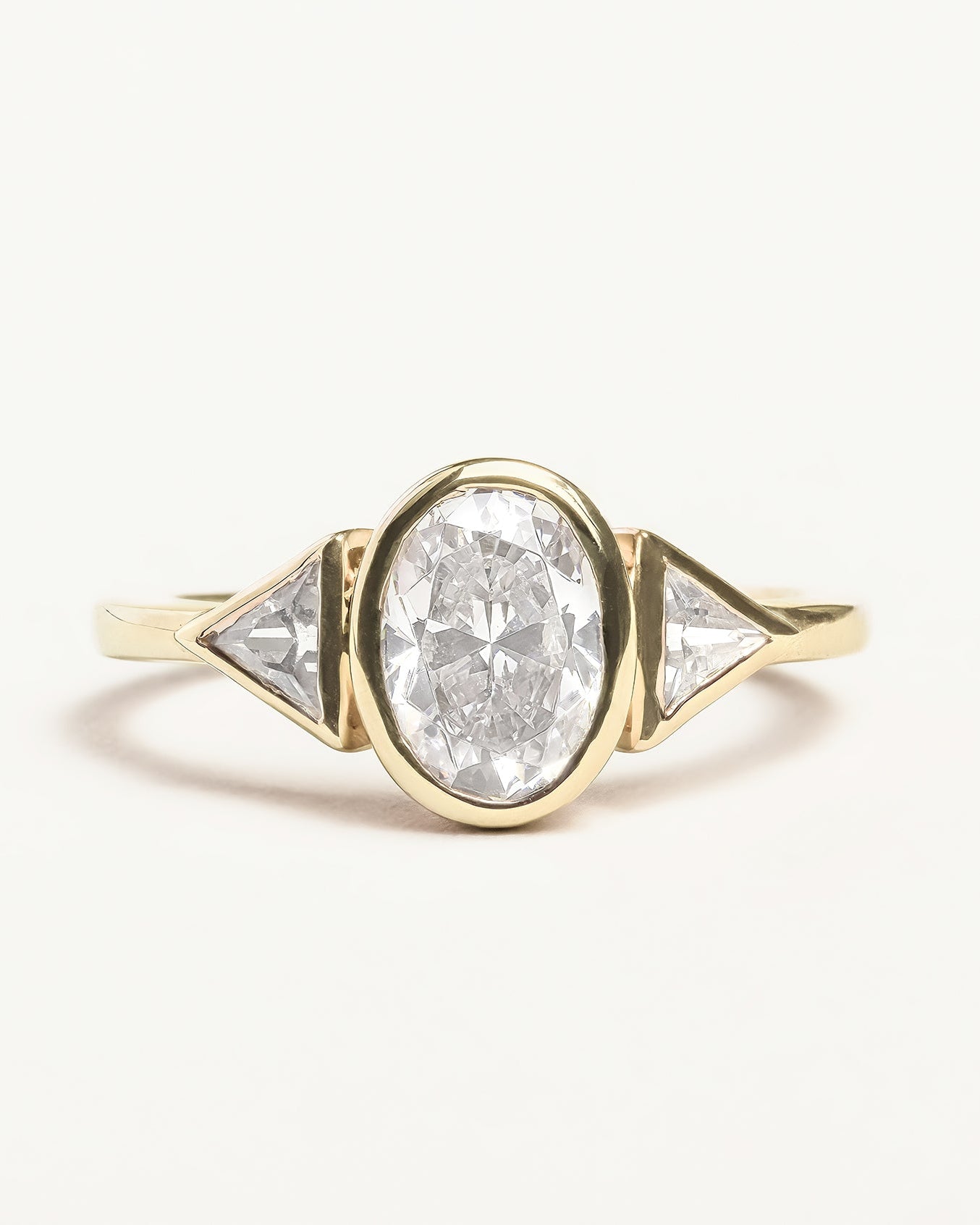 Oval Trillion Cut Diamond Three Stone Bezel Ring Proud Diamond