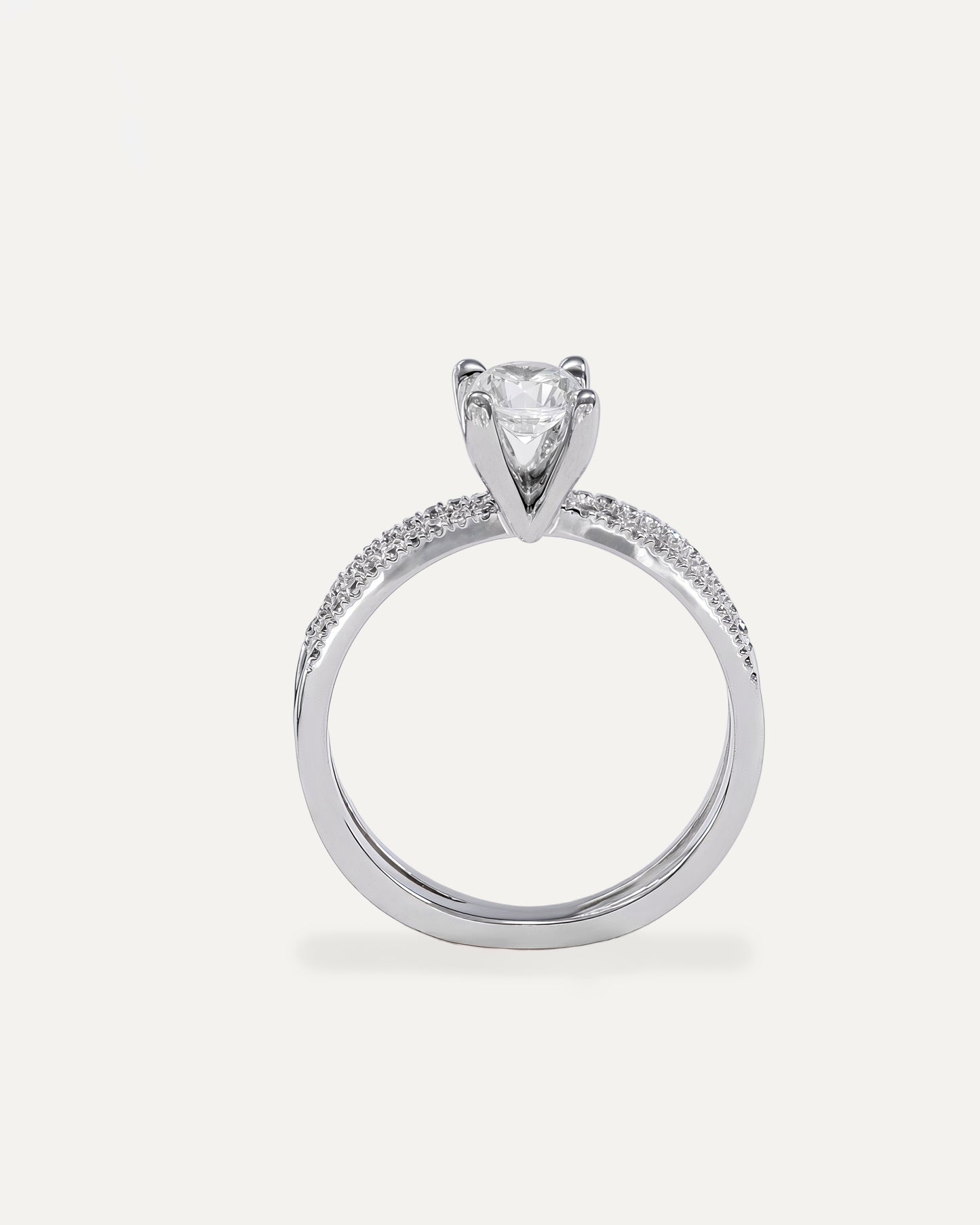 Round cut diamond engagement ring with split pavé bands