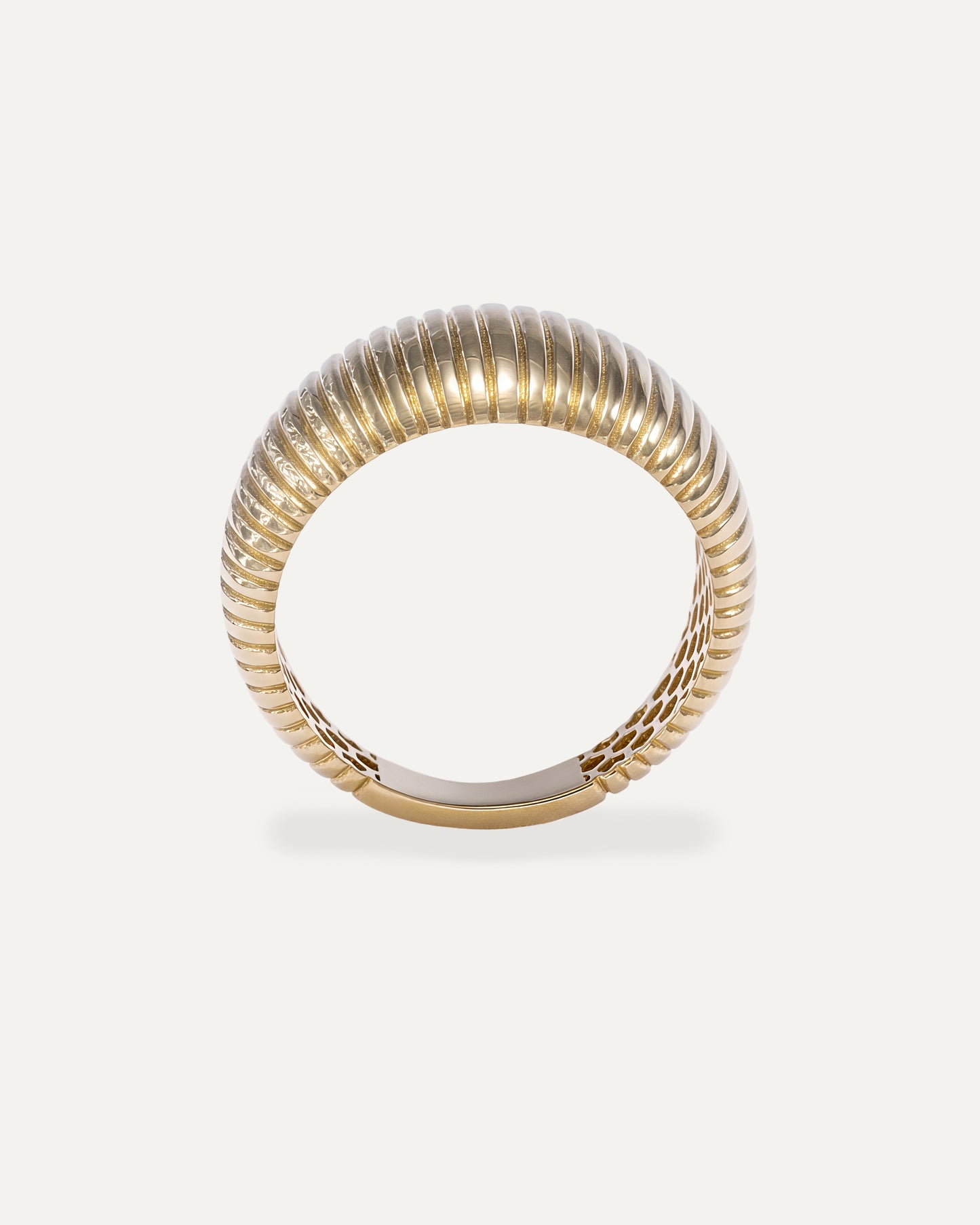 Wide gold ring with lined pattern