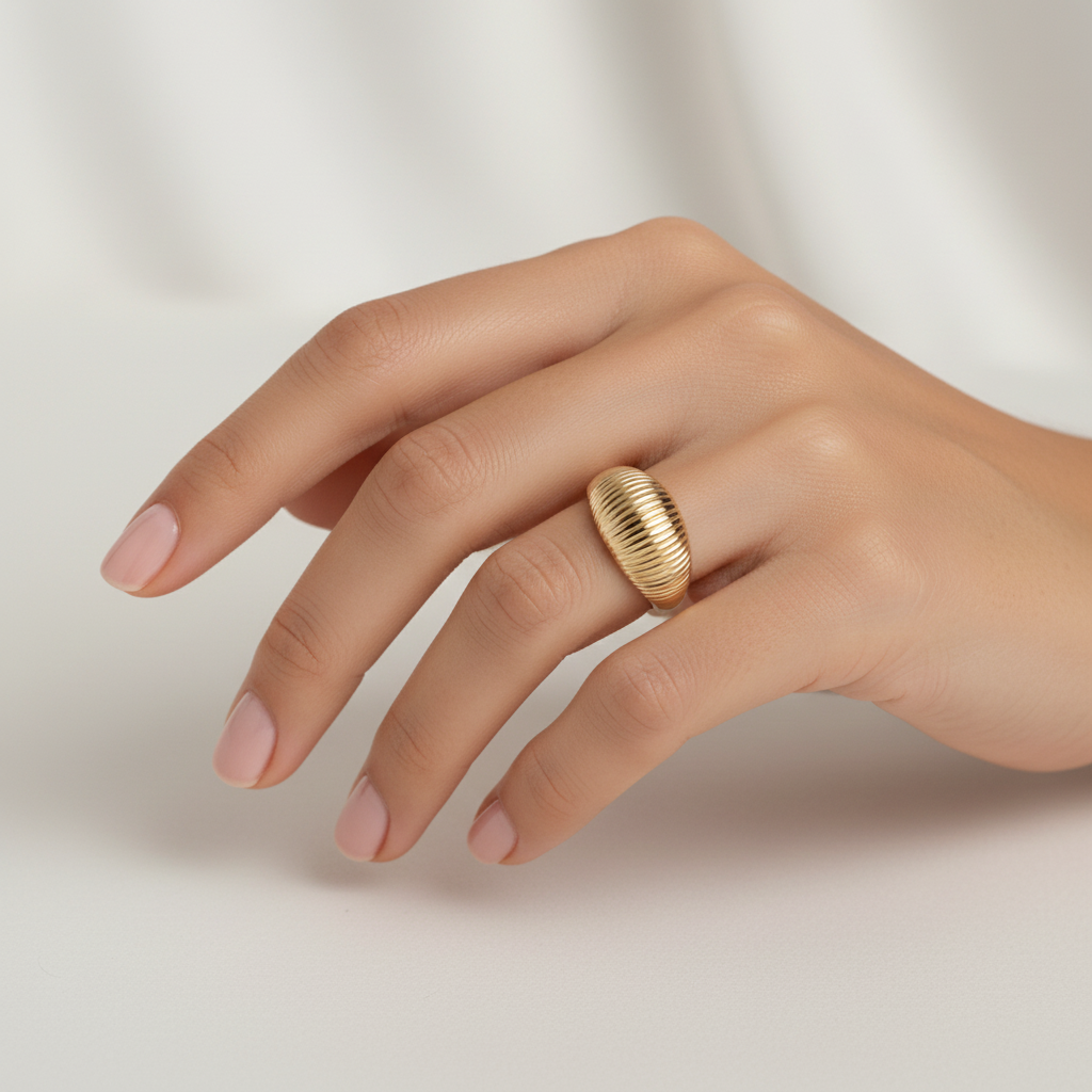 Wide gold ring with lined pattern